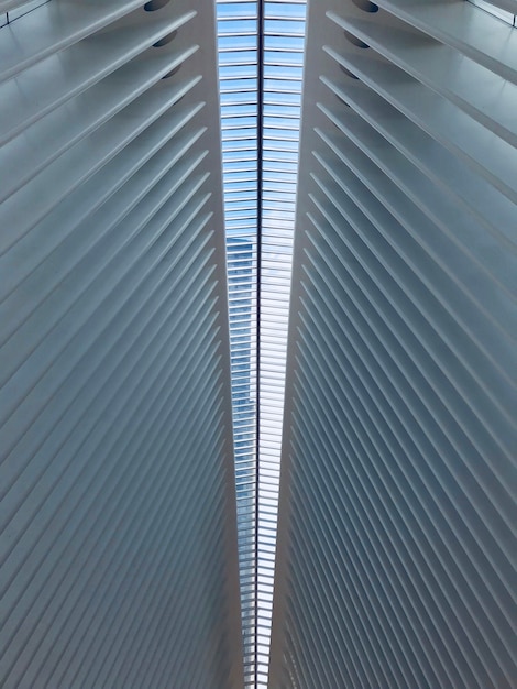 Vertical low angle shot of a white symmetrical ceiling