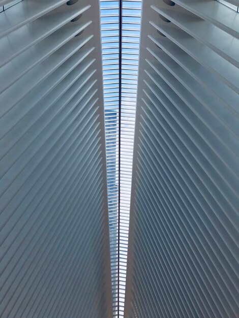 Vertical low angle shot of a white symmetrical ceiling