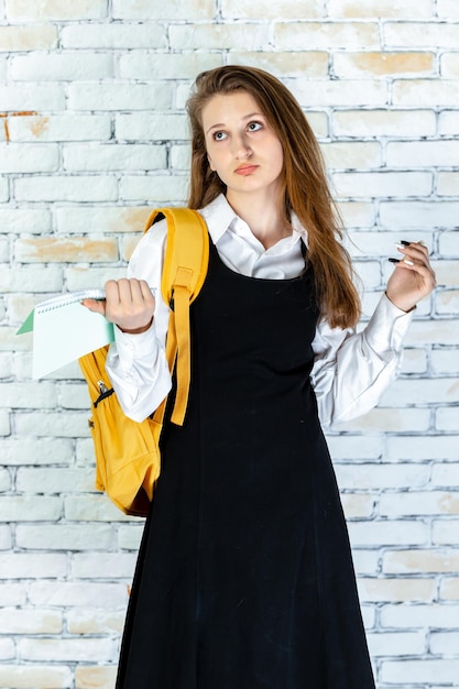 Free photo vertical photo of adorable student on white background high quality photo