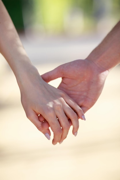 Free photo vertical photo of man and woman hand together high quality photo