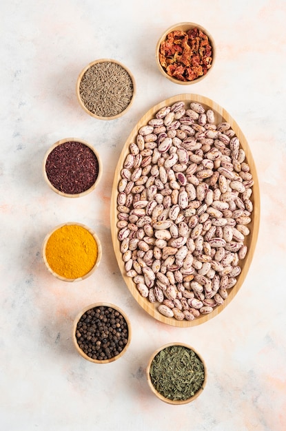 Vertical photo of Pile of Beans with various kinds of spices.