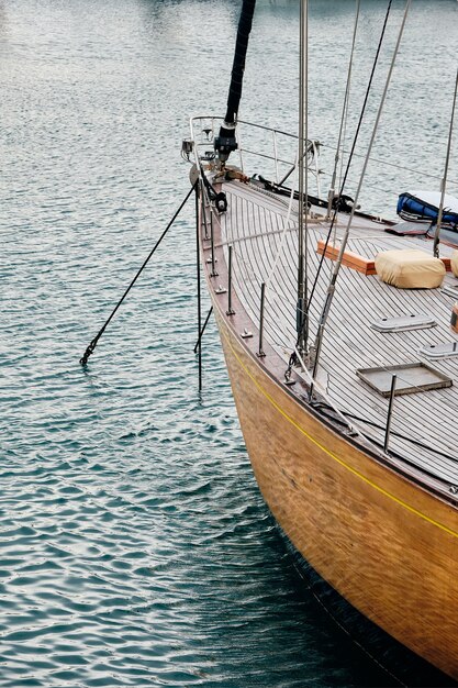 Vertical picture of a sailing boat on the sea under the sunlight