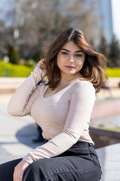 Vertical portrait of young lady looking at the camera with confident High quality photo