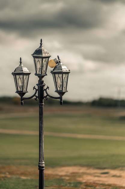 Vertical selective focus shot of a streetlight in the City of Westminster, Abbey road