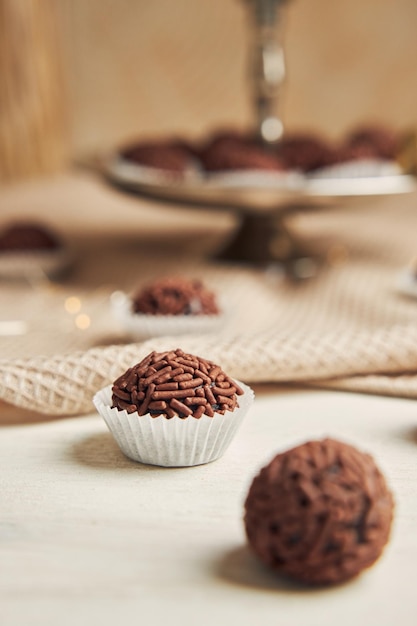 Vertical selective focus shot of a yummy Brigadeiroinkles