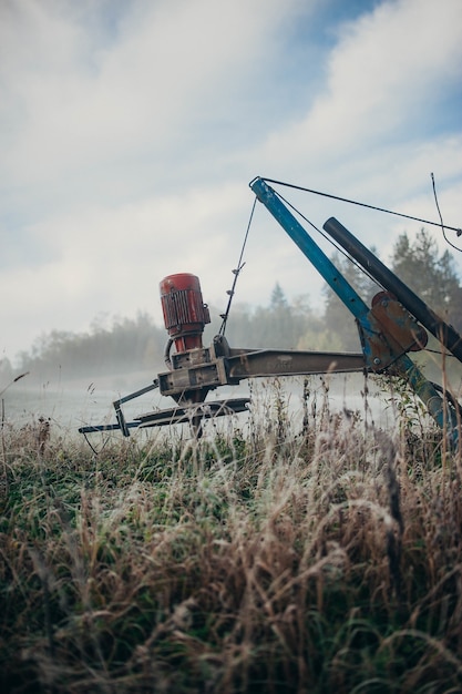 Vertical shot of an agricultural harvester in the field