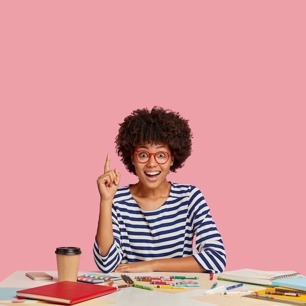 Free photo vertical shot of amazed beautiful woman has overjoyed expression