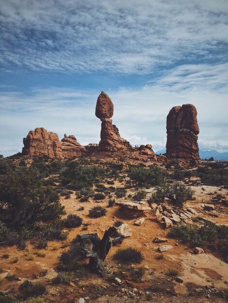 Vertical shot of the balanced rock in arches national park, on a cloudy day