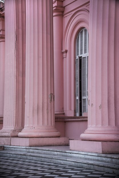Vertical shot of beautiful light pink building design