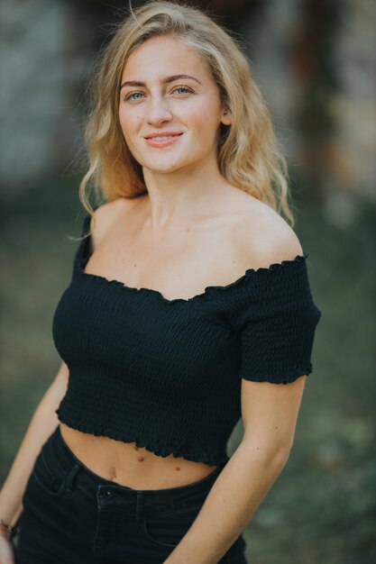 Vertical shot of beautiful smiling girl