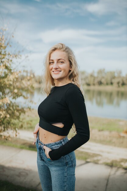 Vertical shot of beautiful smiling girl