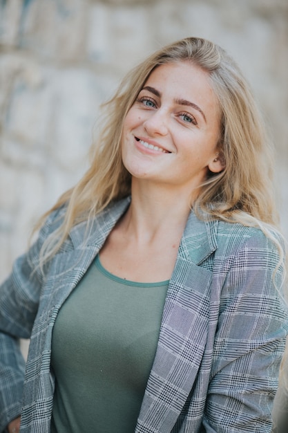 Free photo vertical shot of beautiful smiling girl