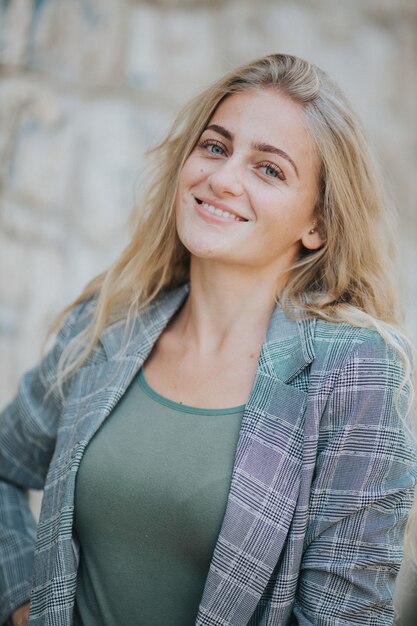 Vertical shot of beautiful smiling girl