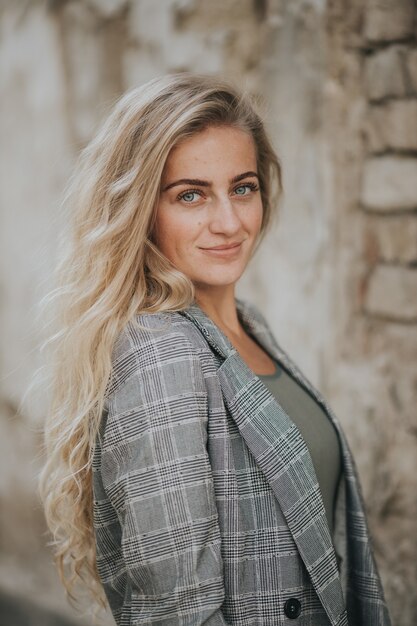 Vertical shot of beautiful smiling woman outdoors