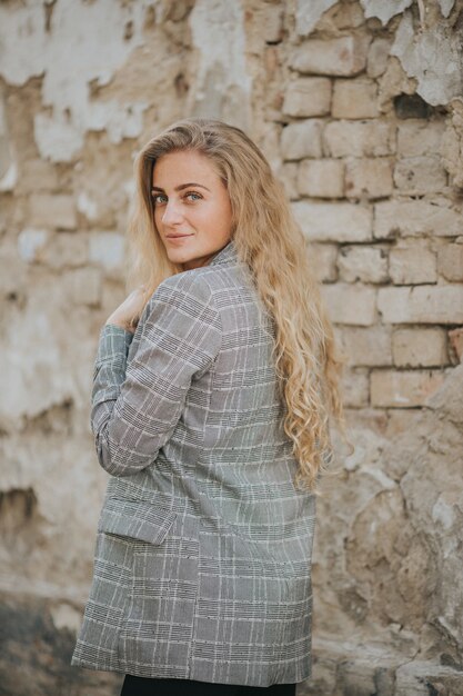 Vertical shot of beautiful smiling woman