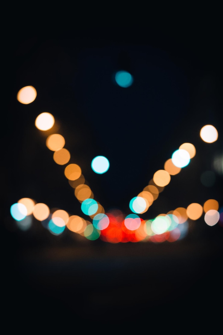 Free Photo vertical shot of the bokeh lights in the street on the dark
