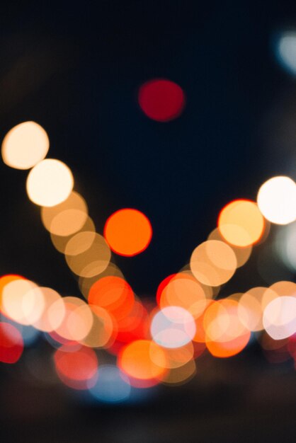 Vertical shot of the bokeh lights in the street