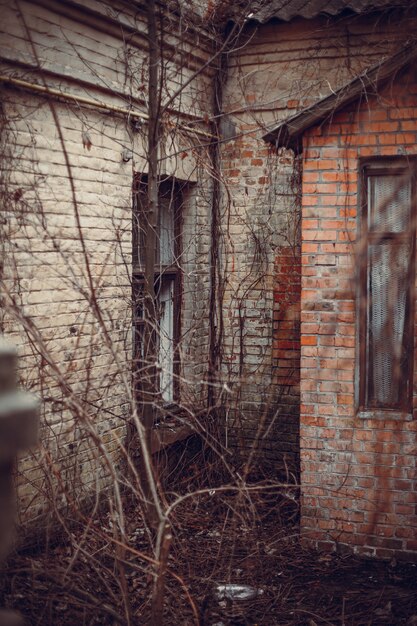 Vertical shot of a brick abandoned building