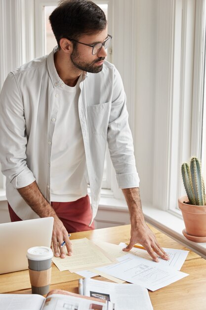 Vertical shot of businessman working at home