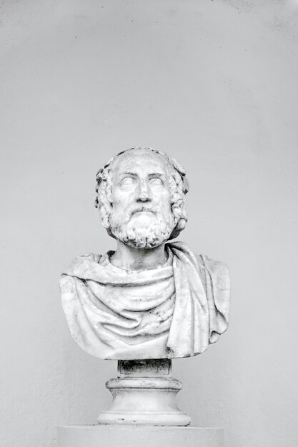 vertical shot of a bust of a philosopher isolated