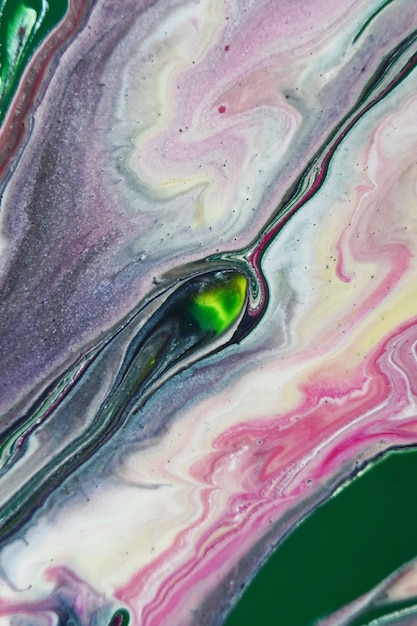 Vertical shot of colorful abstract paints in the water