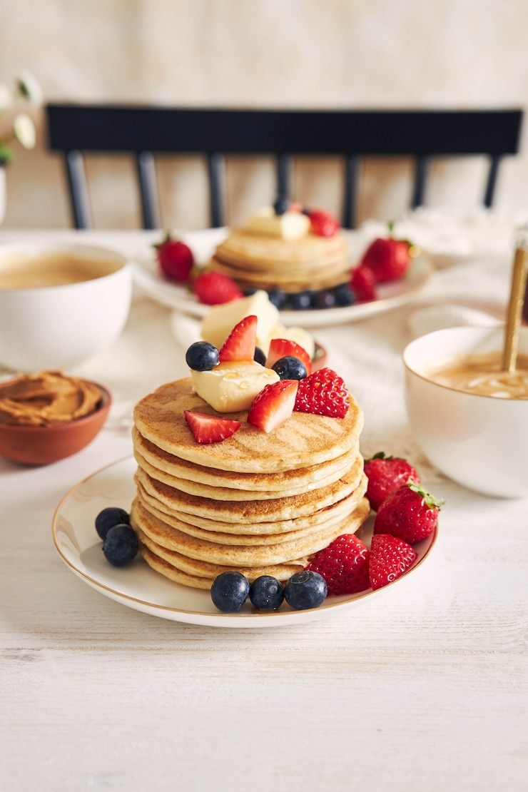Free Photo vertical shot of delicious vegan tofu pancakes with colorful fruits