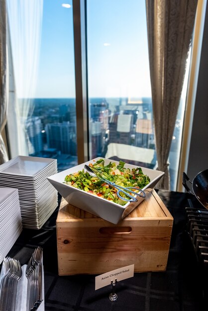 Vertical shot of a delicious vegetable salad in a square bowl