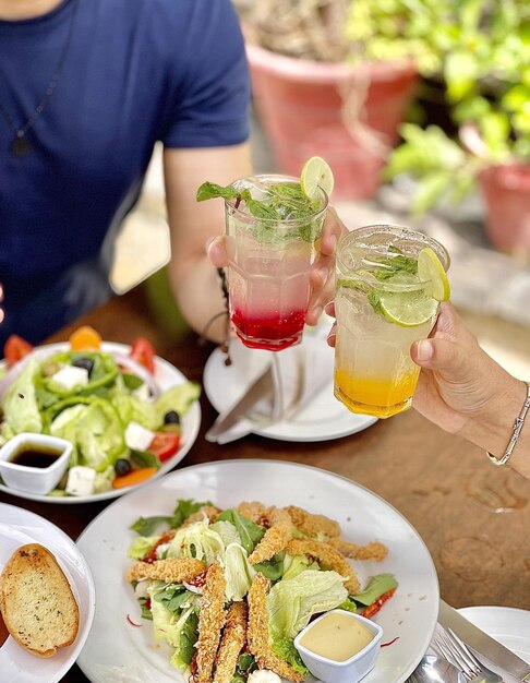 Vertical shot of a dinner table with various types of food