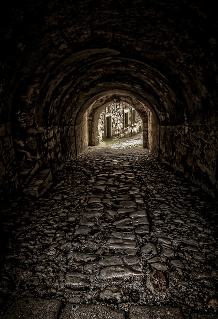 Vertical shot of an empty tunnel towards the  buildings