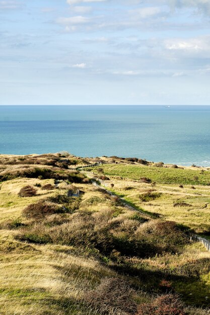 Vertical shot of fields near the shore in Northern France