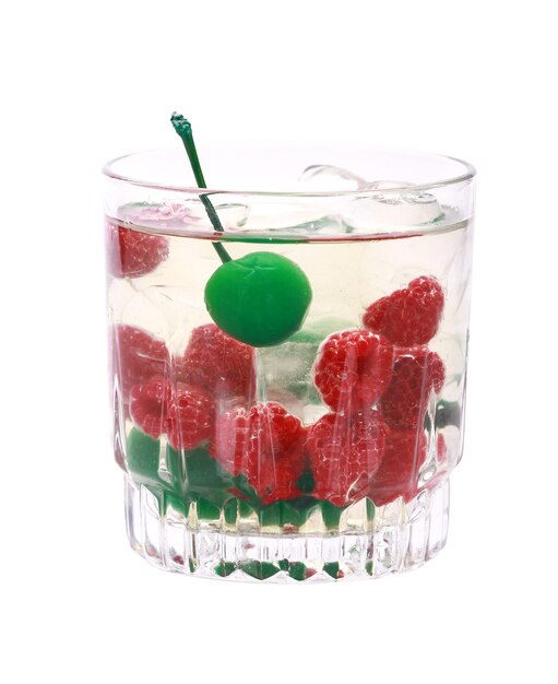 Vertical shot of a glass of gin with raspberries and green maraschino cherries