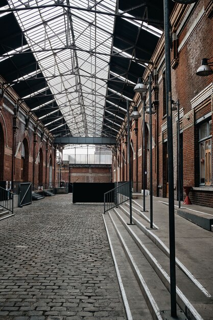 Vertical shot of the inside of a building with arch doors in Roubaix, France