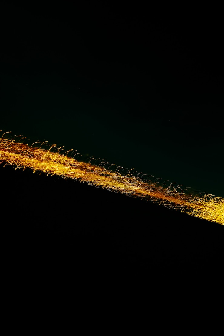 Free Photo vertical shot of linear lights on a black