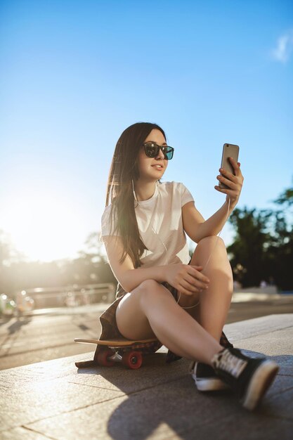 Vertical shot low angle view stylish popular hipster girl live