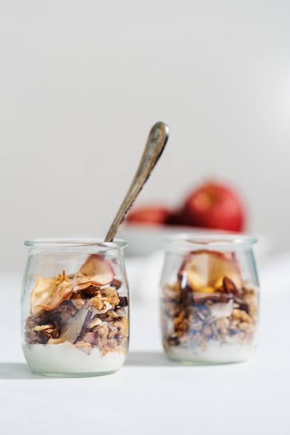 Vertical shot of an oaten breakfast with milk isolated on white