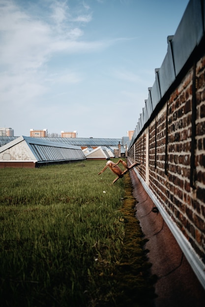 Vertical shot of a park with concrete buildings in Roubaix, France