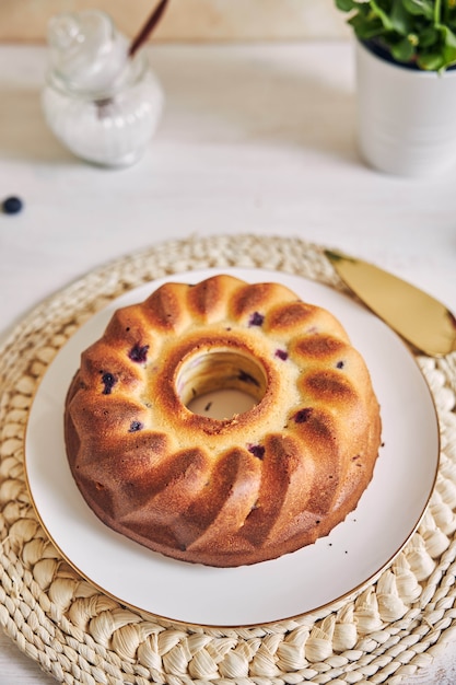 Vertical shot of a ring cake on a white table