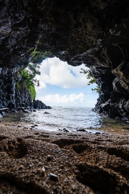 Vertical shot of the rocky Turtle Cove in North Shore, Kauai, Hawaii