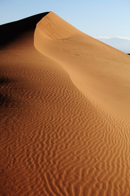 Vertical shot of sand dunes in Xijiang, China