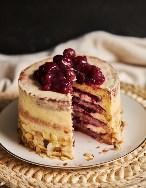 Vertical shot of a sliced cherry cake