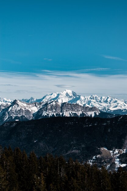 Vertical shot of a snowy mountain during daytime