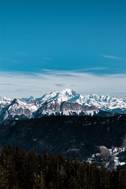 Vertical shot of a snowy mountain during daytime