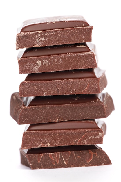 Vertical shot of stacked chocolates on a white background