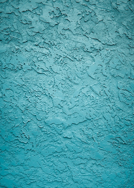 Вертикальный снимок текстур и узоров стены с красивой синей краской