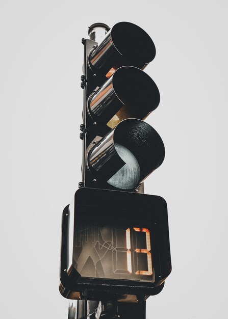 Vertical shot of traffic light with the number 13 on the stopwatch