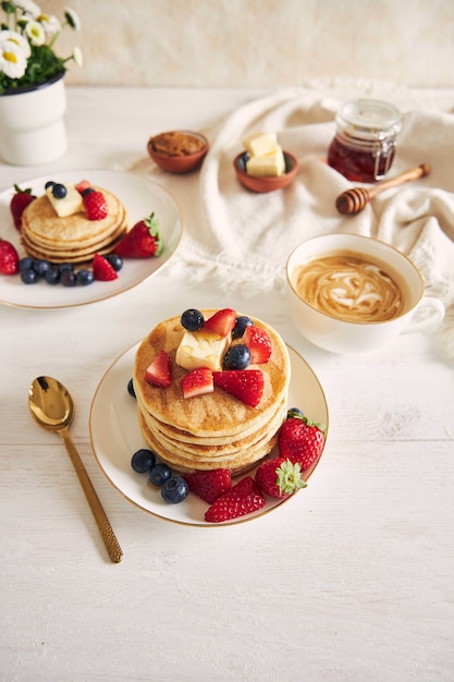 Vertical shot of vegan tofu pancakes with colorful fruits