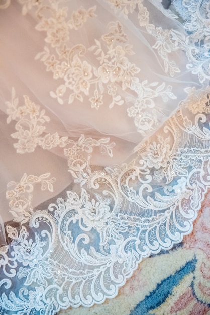 Free photo vertical shot of a white bridal lace fabric