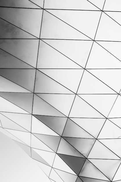 Vertical shot of a white geometrical structure on a white background