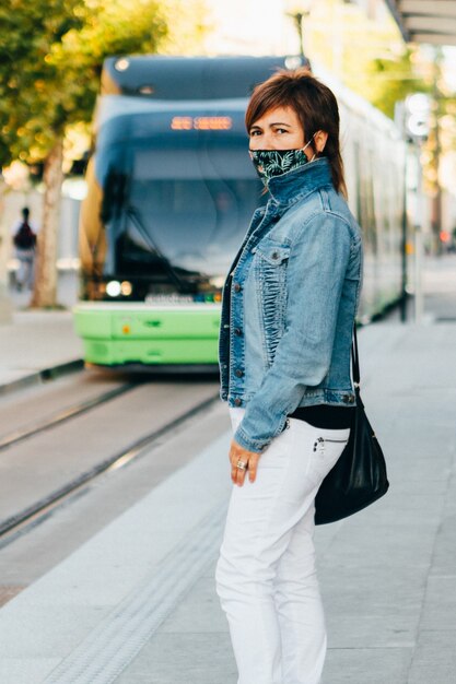 Vertical shot of a woman wearing a facemask