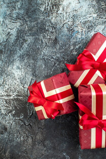 Vertical view of beautifully packaged gift boxes on dark